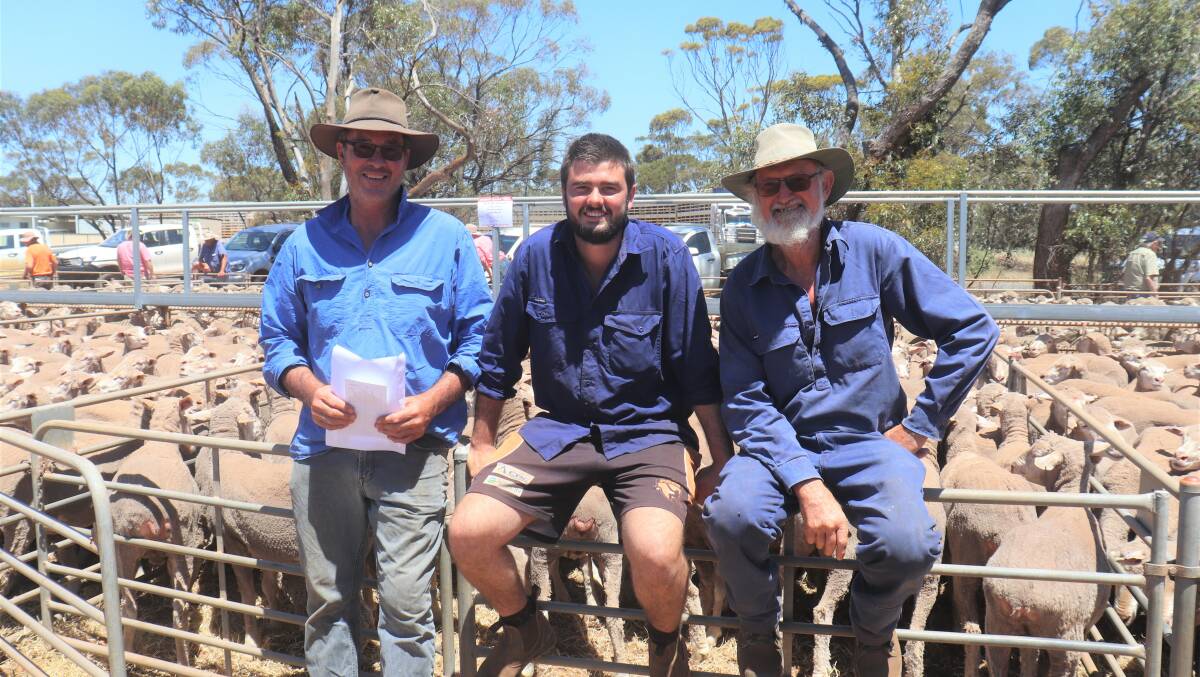 Brad Sinclair (left), New Norcia, Nick Sinclair, New Norcia and vendor Graham Johnson, Piawaning, caught up before the sale at Moora.