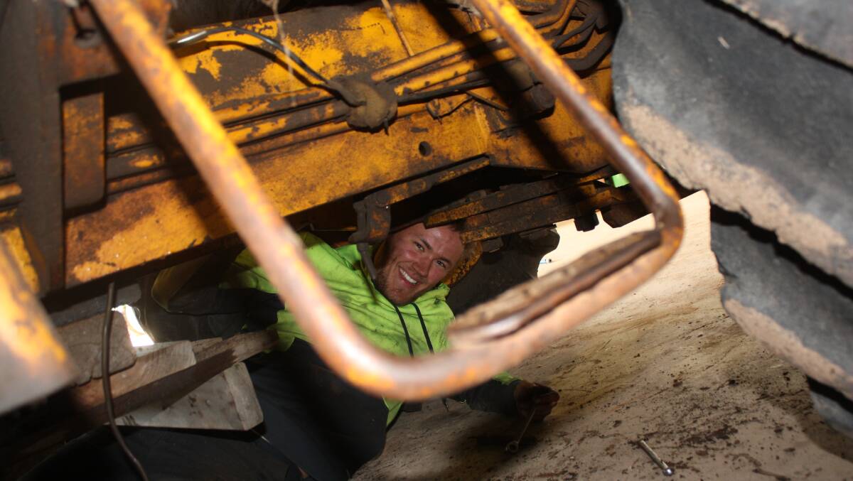 A noise underneath a Chamberlain C6100 tractor at the Letter brothers' shed at Tambellup last year alerted Torque to this smiling face  German backpacker Nils Koch.