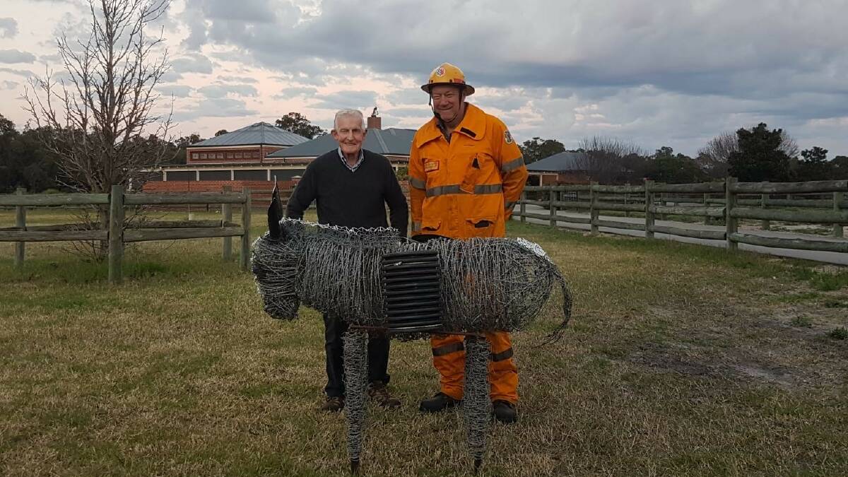 Vendor Ian Nunn (left), Hopeland and Ray Elliott, Serpentine Bush Fire Brigade, with one of Mr Nunn's hand-made wire art pieces which were sold at the Nunn family's clearing sale and all sale proceeds of the artwork donated to the Serpentine Bush Fire Brigade.