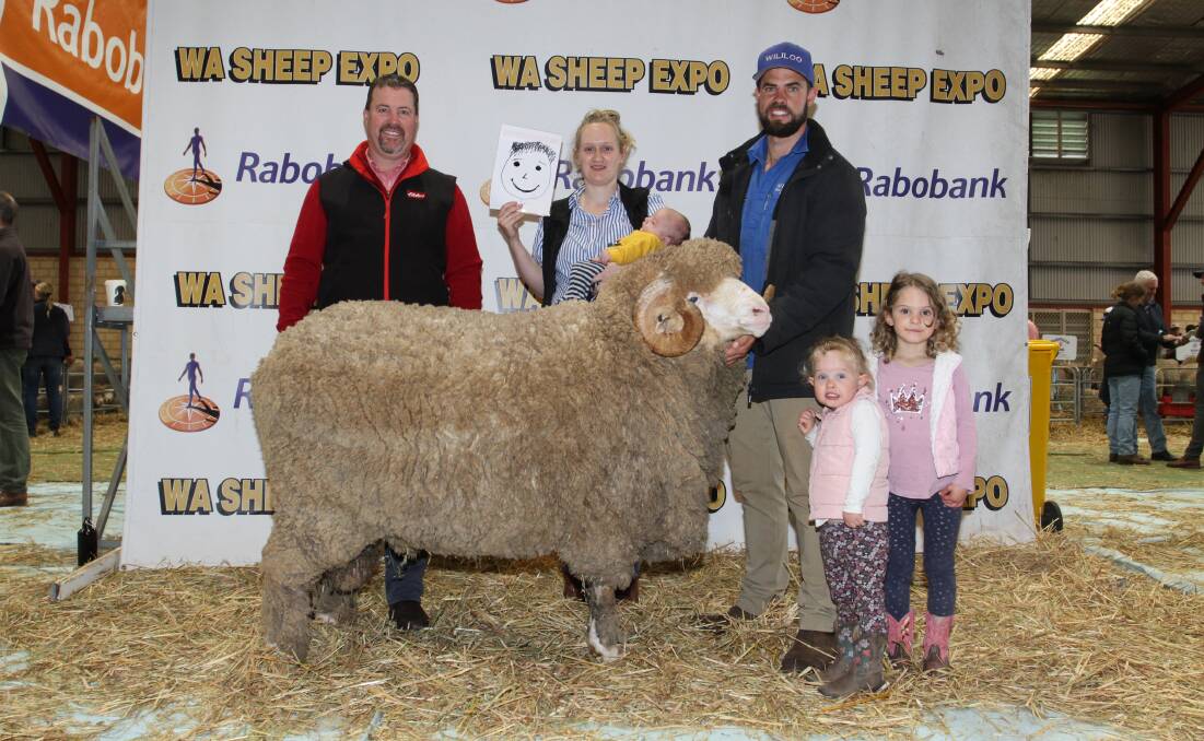With the Wililoo August shorn Merino ram that sold for $10,000 to Bill Bailey, WJ & GF Bailey, Needilup, were Nathan King (left), Elders stud stock and Tegan and Rick Wise, Wililoo stud, Woodanilling, and their children Hunter, Eva and Lydia.