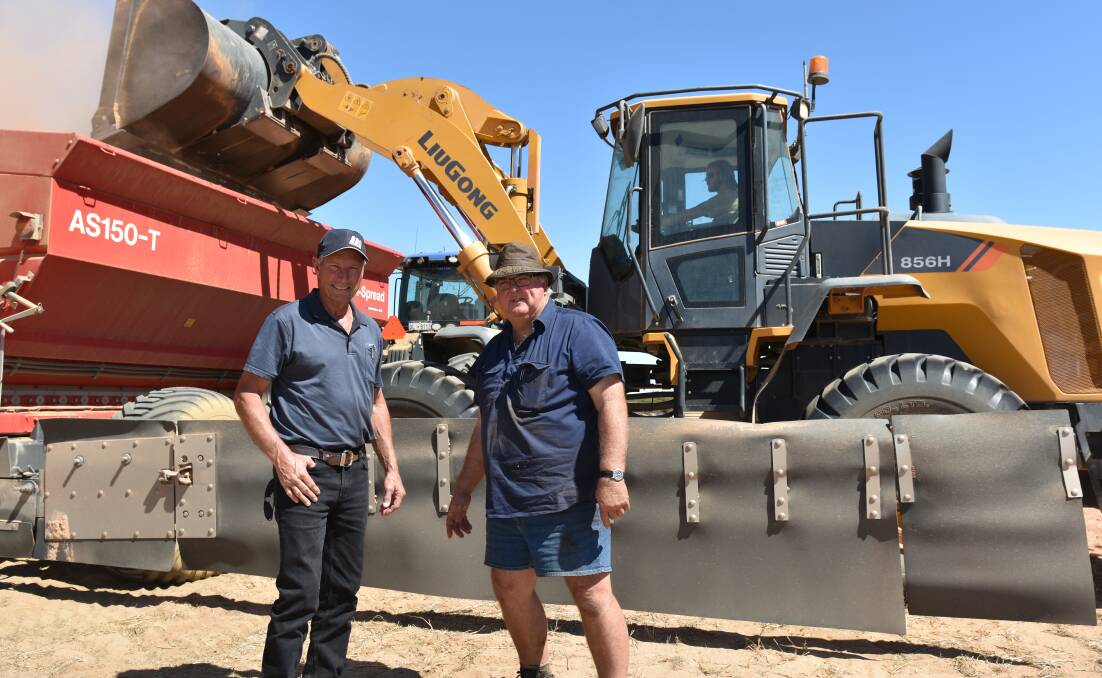David Trindall, (left) McIntosh & Son, Wongan Hills, with Graeme Hathway, Kalannie, during loading operations in the paddock with the family's standard LiuGong 856H wheel loader prior to topdressing.