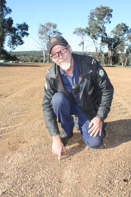 "This is good soil and there's no run-off," Wooroloo Prison Farm manager Dave Traylen said, pointing to a germinating Mammoth oats plant.