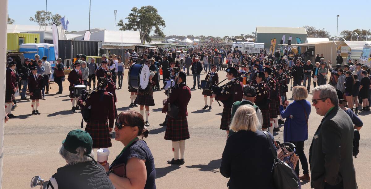 The crowds stretched as far as the eye could see along the avenues of the field days, with entertainment such as the Scotch College Pipe Band keeping visitors entertained.