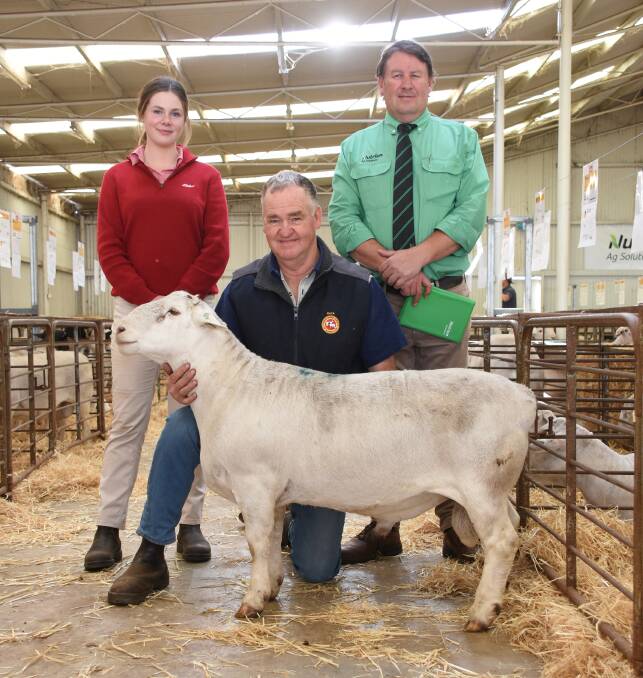  With the $4300 top-priced White Dorper ram which sold to the Red Rock stud, Keith, South Australia, at last week's Kaya Dorper and White Dorper Production Sale were Elders trainee Alex Prowse, Kaya principal Adrian Veitch and Nutrien Livestock Breeding representative Roy Addis, who purchased the ram for Red Rock over the phone.