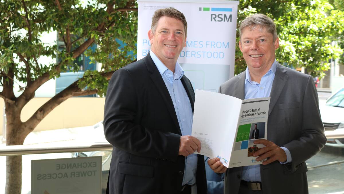 Ross Paterson (right), RSM's national leader, agribusiness and Matt Beevers, director of audit and assurance at RSM, with the company's The 2022 State of Agribusiness in Australia report.