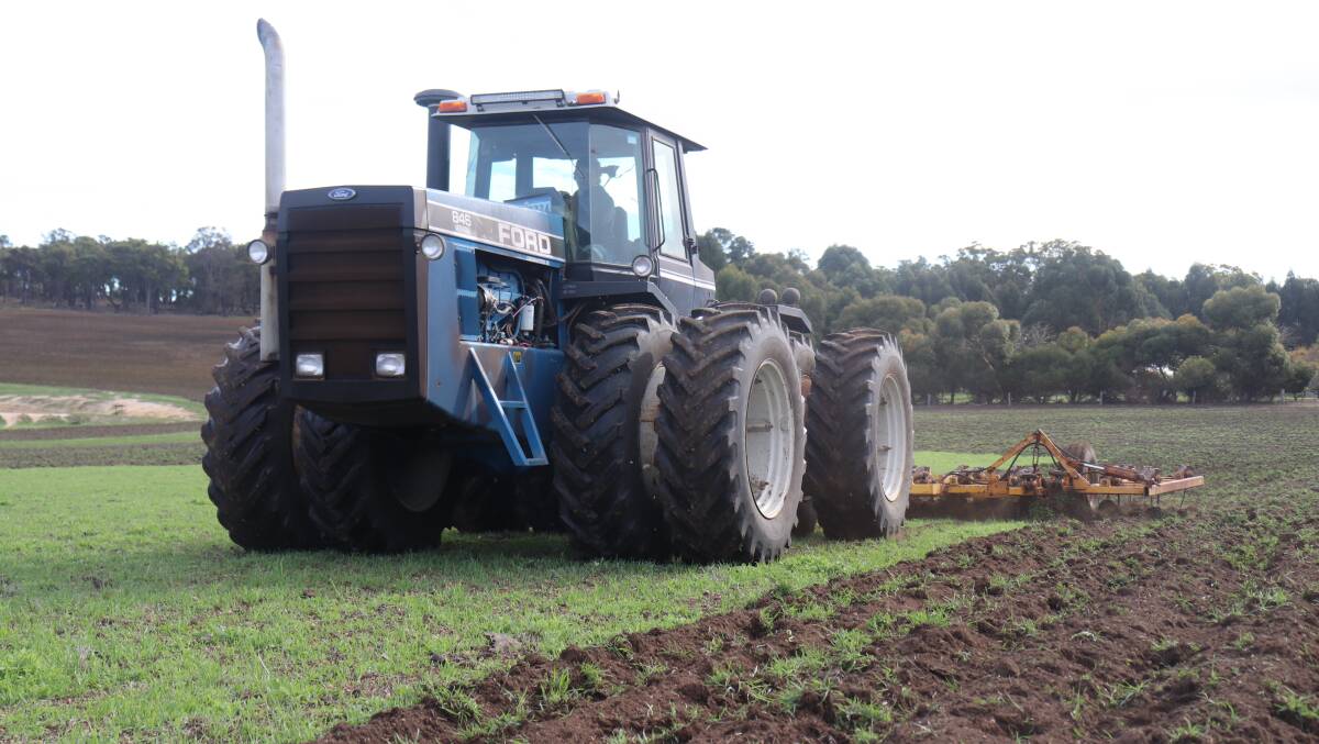  Preparing the last 30 hectares with the 1990 Verstatile tractor and Chamberlain scarifier.