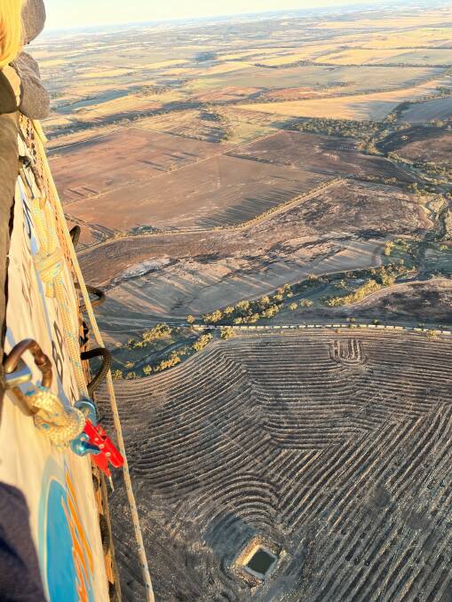 Recent sowing of crops provided interesting patterns on the ground, making the Wheatbelt look like a patchwork quilt. The line across the centre of the picture is a CBH grain train on the Northam-Goomalling track.