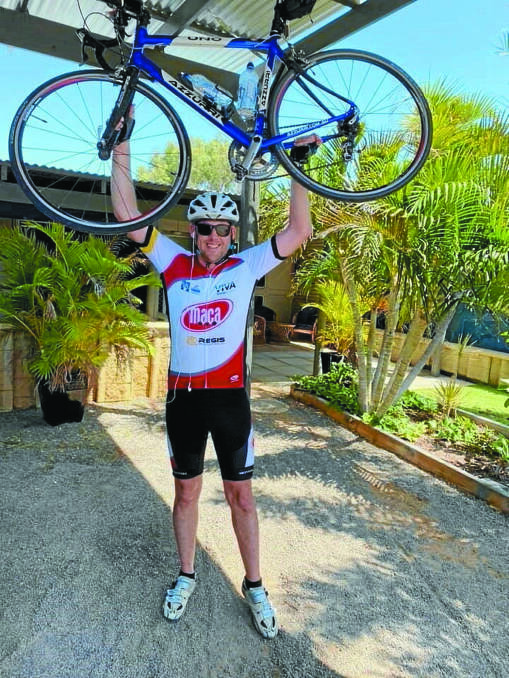 Geraldton man Stuart Bain celebrates completing the240km bike ride last year.