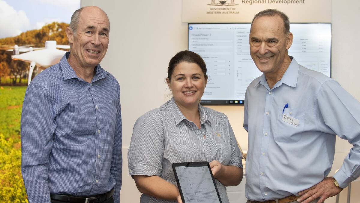 DPIRD research scientists Dr Dean Diepeveen (left), Georgie Troup and crop science and grain production manager Dr Bob French test out the upgrade to the department's FlowerPower online tool at the GRDC's Grains Research Update in Perth.