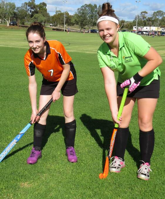 Sticks down: Stephanie Donegan and Molly Dickson play for Titans. Here they are pictured on Saturday morning just before their big game.
