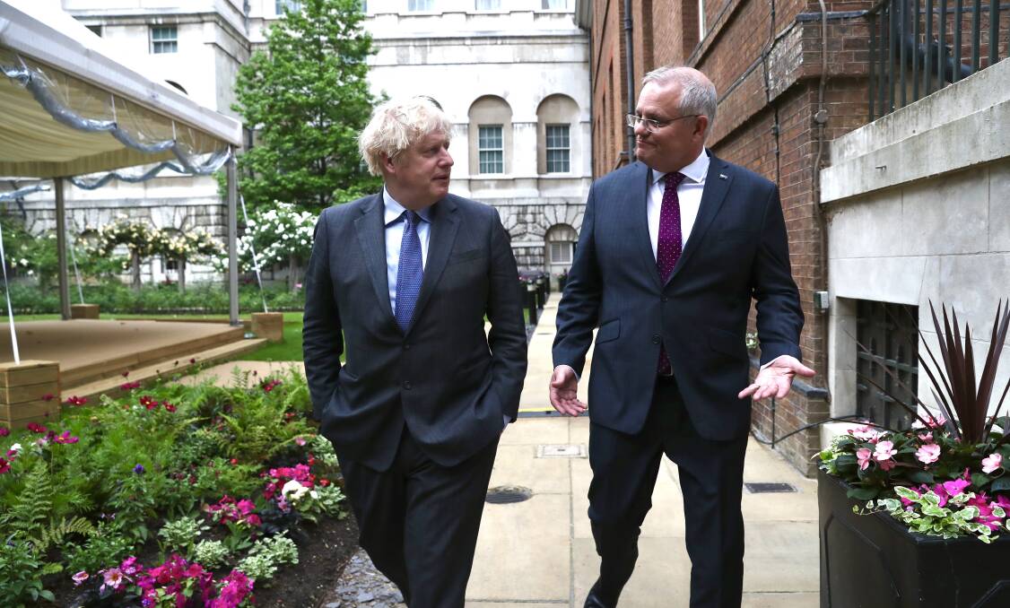 SIGNED, SEALED, DELIVERED: UK PM Boris Johnson with Scott Morrison.