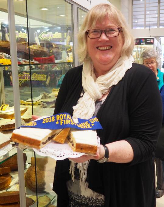 Adelaide Hills author Liz Harfull at the 2018 Royal Adelaide Show with the winning Hinkler cake. Each year Liz sponsors a trophy in the novice section to encourage new competitors to enter. Picture supplied.