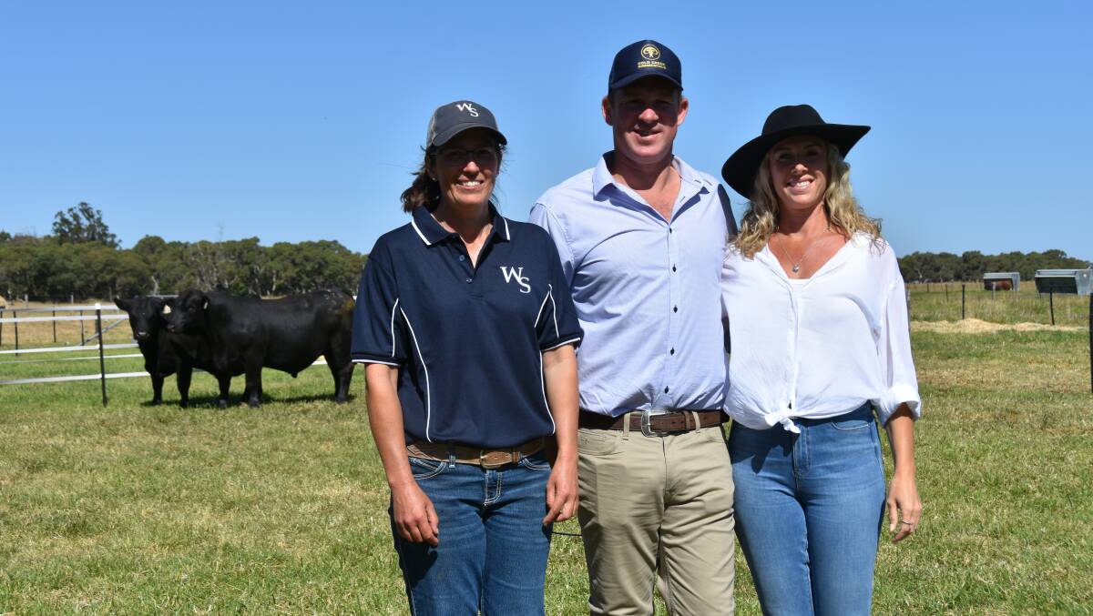 Woonallee stud's Lizzy Baker with Tom and Anna Sanson, Gold Creek Simmentals, Gisborne, NZ who bought the $35,000 highest priced Black Simmental bull. Picture by Catherine Miller