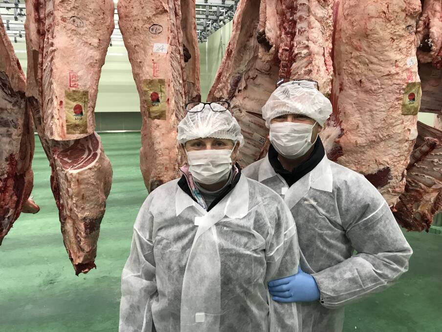 LESSONS: NSW bull breeders Jeremy and Carmen Cooper examining Wagyu carcases in a Japanese processing facility.