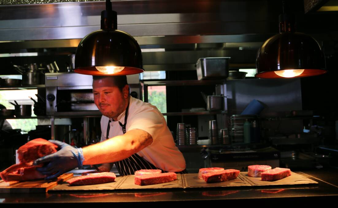 Chef Trent Robson preparing Westholme Wagyu for cooking.