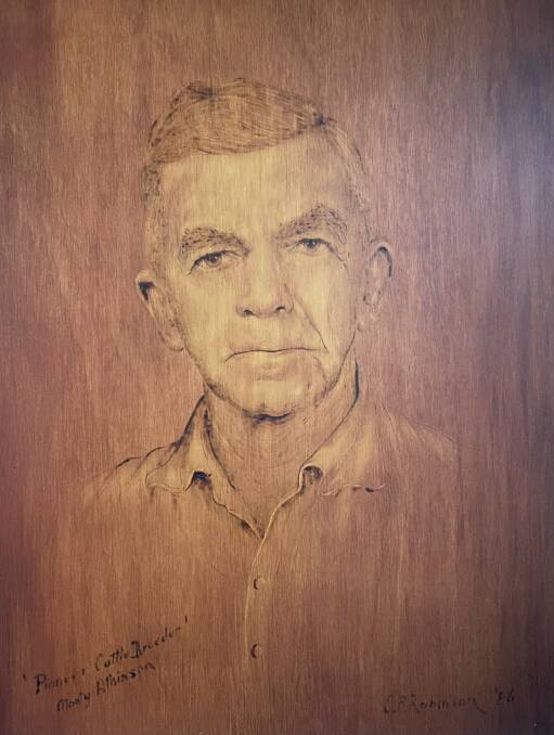 A portrait of Monty Atkinson burnt into plywood.