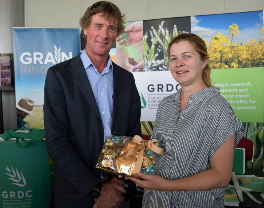 Michael Chilvers, GRDC southern panel member, presents Sarah Noack with her award as an emerging grains industry leader.