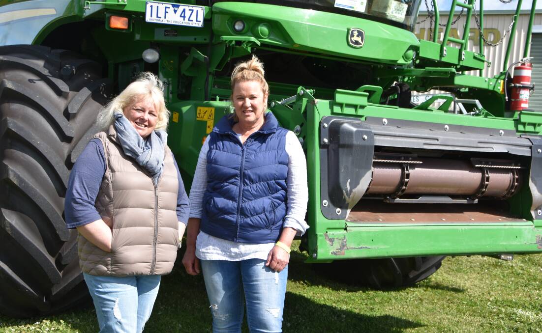 Kerry McFarlane and Julie Cummins from Quambatook check out one of the headers on show at the Emmetts Celebrating Women in Agriculture day.