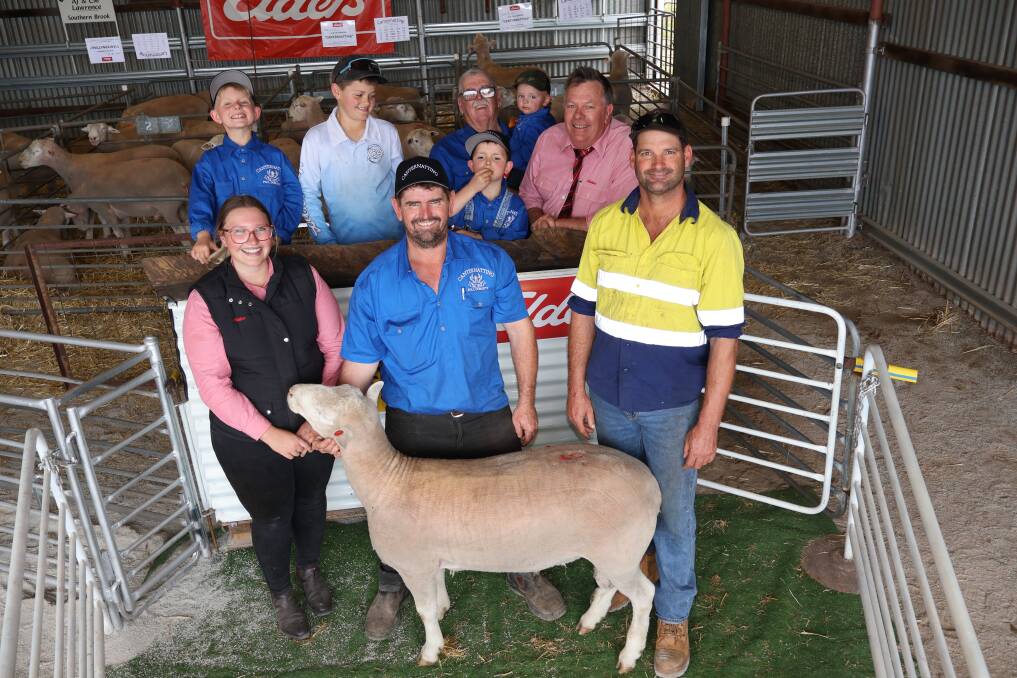 Veejay Lawrence (back left), 9, Southern Brook, Jye McPherson, 10, Jennacubbine, Mack Lawrence, 6, Allen Lawrence holding grandson Marley Lawrence,2, Elders livestock manager Muchea, Graeme Curry, Elders territory sales manager Northam, Amber Lewis, Canternatting stud principal, Nathan Lawrence and buyer Scott McPherson Jennacubbine, who was a volume buyer and bought the top-priced Canternatting Poll Dorset at the sale, as well as the second top price.
