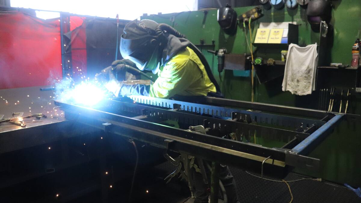 Josh Collins MIG welding a sieve frame to suit a Case IH flagship model combine harvester at Harvestaire Pty Ltd, Balcatta.
