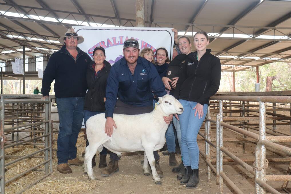 Top-price ram buyers at the sale were Kent (left) and Nicole Muir, Wyndarra Grazing, Perup, and holding the top-price ram is Babanginys Rhys Muir with Billie and Helen Norris, Sophie Muir holding baby Eve and Nutrien Kojonup representative Charlie Wood.