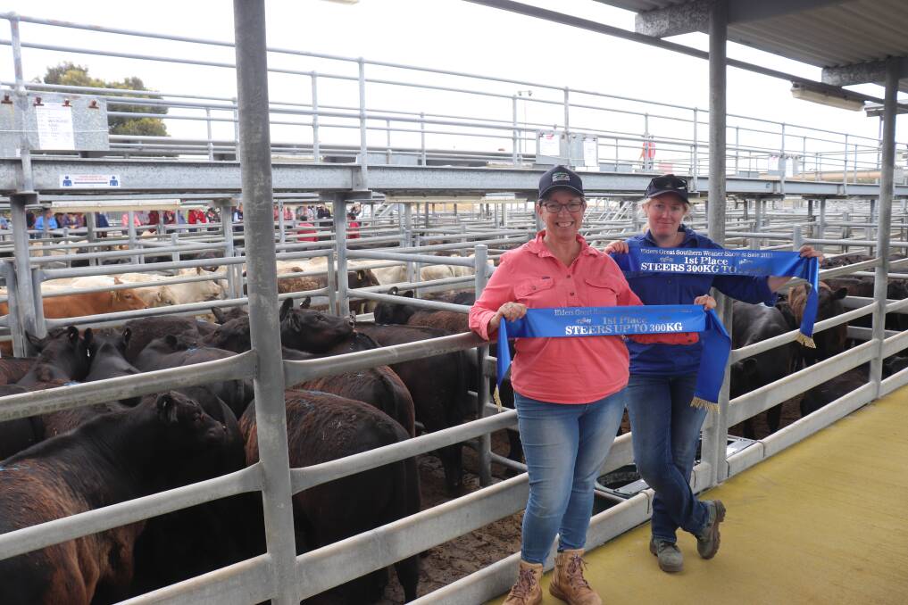 Tracey (left) and Siobhan Smith, Yarralena Grazing, Cranbrook, with their winning pen of steers that won the class for steers weighing 300-350kg. The pen included 16 Angus weaner steers weighing 336.9kg and sold at 612c/kg returning $2061. The Smiths also won the category for steers weighing less than 300kg.