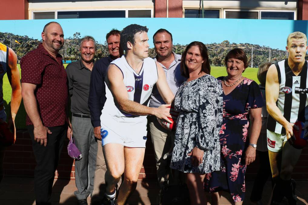 Former Fremantle Docker Paul Hasleby (centre) was joined by his family members brother Craig (left), father Rick, brother Damien, sister Janiele and mother Kerry.