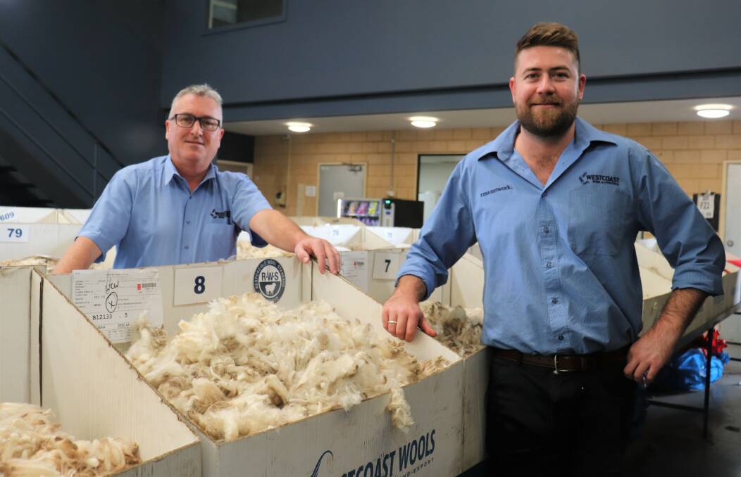 Westcoast Wool & Livestocks auctioneer Danny Ryan (left) and Responsible Wool Standard specialist Justin Haydock with some of the Hill Padua wool samples that tested up to 71N/kt and sold to a price premium of up to 20 per cent over other wools of the same micron.