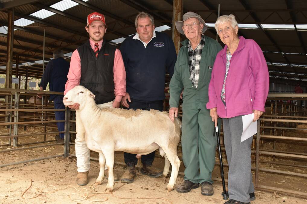 Elders livestock trainee, Marshall Bowey holds the $4500 top price White Dorper ram at Ida Vale's sale last week. With him is Ida Vale joint studmaster Andrew Greenup and buyers Ron and Ruda Edwards, Muchea.