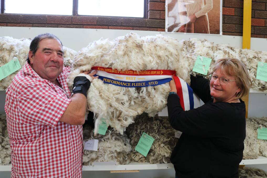 Scott and Sue Pickering with their local commercial best performance fleece. They also won medium and strong wool championships.