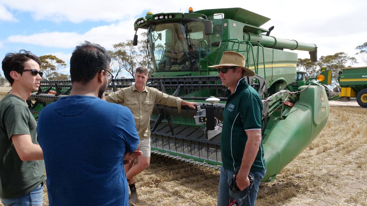 AHRI research agronomist Michael Ashworth (centre) helped to develop the new system to detect where weeds are in a paddock at harvest time and report that back to farmers.
