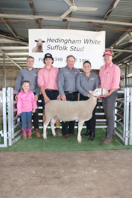 Jayk (back left) and Lillie Jones, 4, from Hedingham stud, Wickepin, with Elders Narrogin representative Mitch Keppel and Hedingham stud representatives Warren Thompson and Emma Bentley with the White Suffolk ram bought by LR & S Sims, Narrogin for $2300, held by Elders Narrogin representative Jeff Brown.
