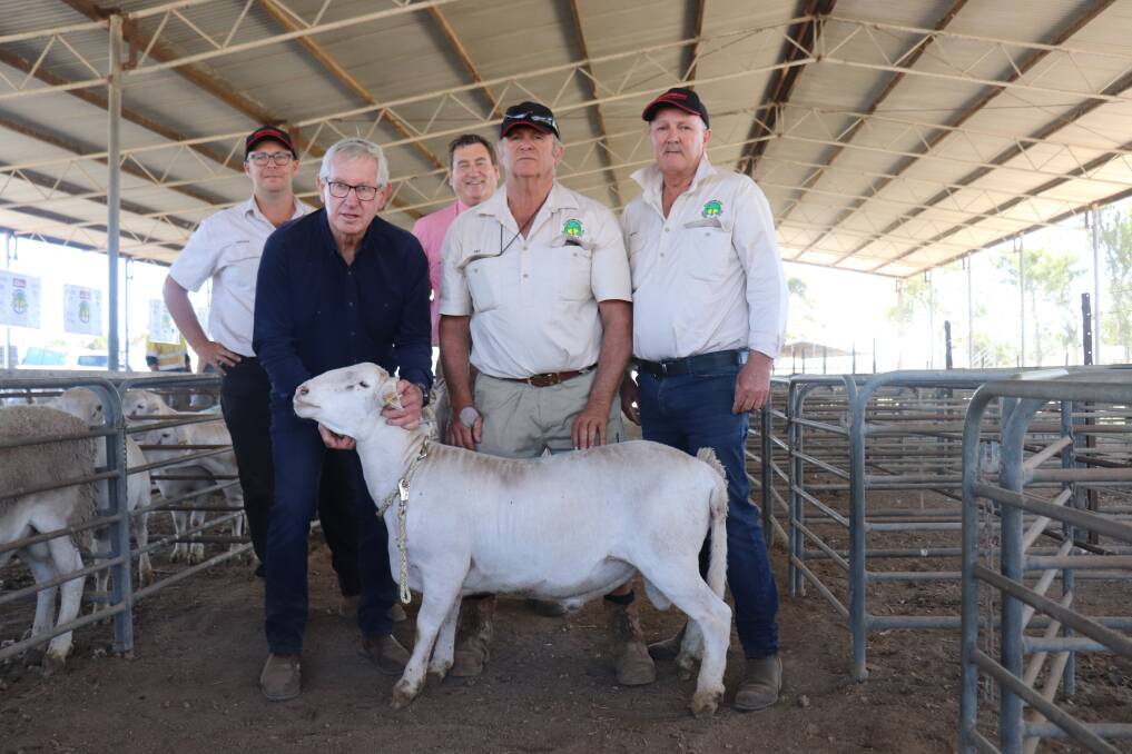 SheepMaster founder Neil Garnett holds the $8000 top priced Rainbows Rest ram at the SheepMaster Mid West ram and ewe sale at Carnamah. With him are Rainbows Rest stud co-principals Tristan Reed (left) and his father Des, Rainbows Rest studmaster Geoff Crabb and Elders stud and commercial sheep manager Tim Spicer (rear). The ram was bought by newly-formed corporate PenAgri Farms Pty Ltd, Perth.