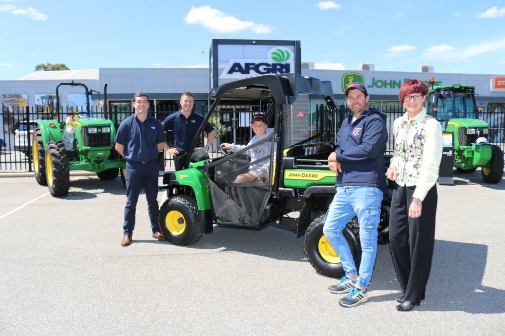 At the AFGRI Equipment showroom in South Guildford last week for the handover of the AFGRI Equipment and Farm Weekly Win a John Deere Gator competition prize were AFGRI Equipment's marketing and small ag manager Jacques Coetzee (left) and branch manager Matt Utley, with the winners 11-year-old Fraser and his father Jay Robertson, Kulin and Farm Weekly business development and sales manager Wendy Gould.
