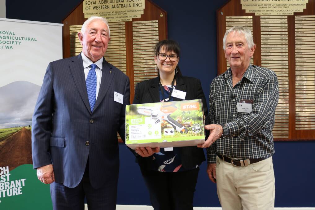 Guest speaker John Garland AM did his bit for the cause when he bid $240 at auction for this electric pruner, donated by Stihl Shop, Osborne Park. With him were Ability WA manager of partnerships Ingrid Barnard and charity auctioneer Richard Gapper, Attadale.