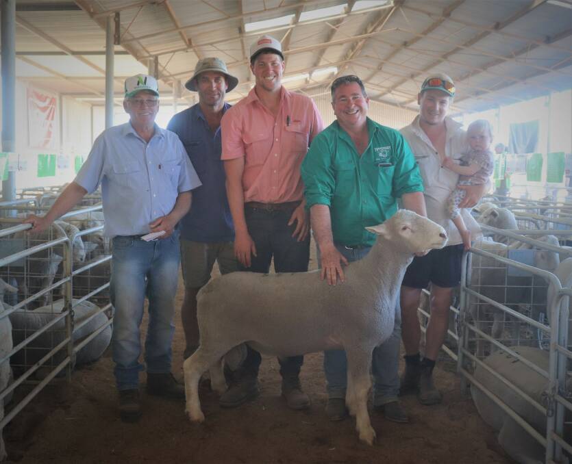 Equal second top-priced Poll Dorset buyers at $2100 Bernie Soullier (left), Yandanooka and Aaron Edwards, Bluff Point, Elders livestock representative Geraldton, Tom Page, Tipperary stud principal Randall Levett and Phill Soullier, Yandanooka with daughter Matilda at the Chapman Valley Breeders Ram Sale last week.