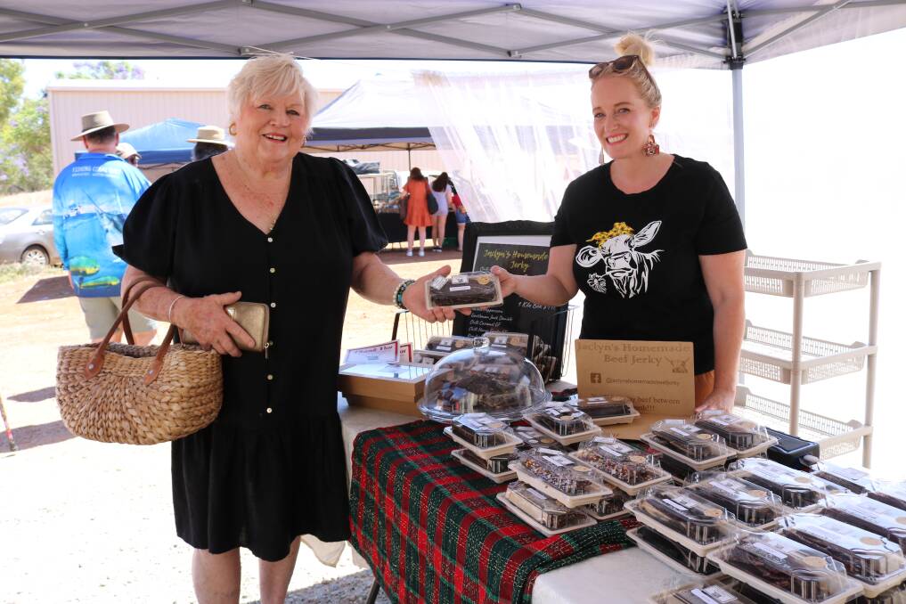 Barbara Drinkwater (left), Bolgart, bought some beef jerky from Jaclyn Workman, Jaclyn's Homemade Beef Jerky, Moora. Ms Workman started making the jerky for her diabetic son and it has grown into a business, for which she "buys everything except the packaging locally to keep money and jobs in our town."