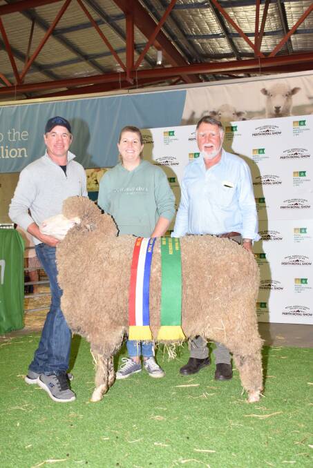 The reserve grand champion Merino ewe and champion strong wool Merino ewe was exhibited by the Mullan family's Eastville Park stud, Wickepin. With the ewe were stud co-principals Grantly (left), Elise and Rob Mullan.