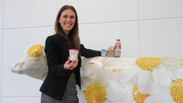 Brownes Dairy chief executive officer Natalie Sarich-Dayton with some of the products the company plans to export to Singapore and later Thailand and Malaysia, with the help of a State Government grant.