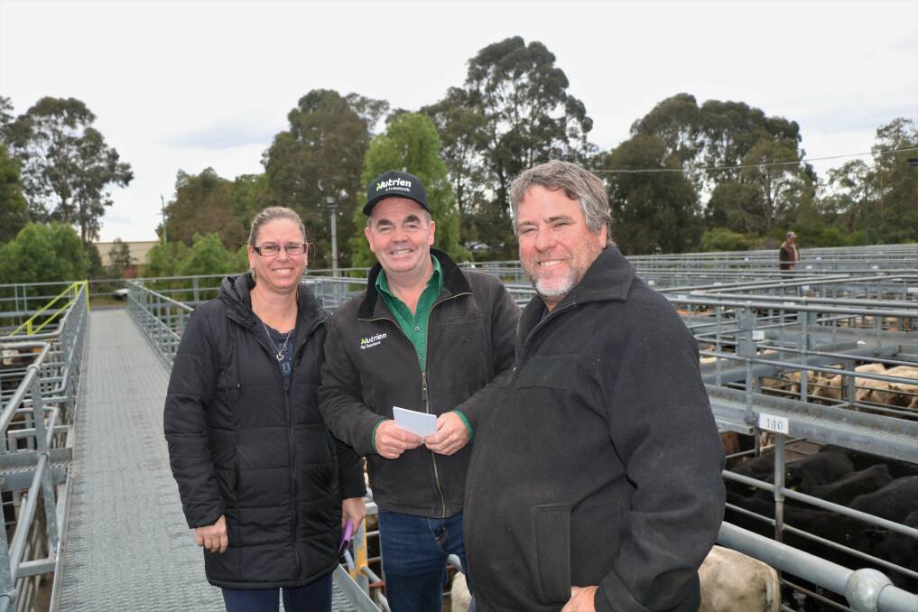 Nutrien Livestock, Boyup Brook agent Jamie Abbs (centre), with Kelli and Stephen Michela, North Boyanup, advised them on what to buy at the Nutrien Livestock sale.