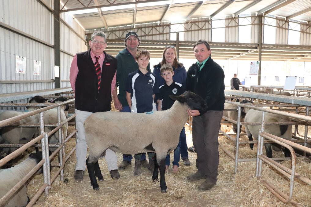 Elders stud stocks, Michael O'Neill, Karinya Suffolk studs Richard Phillips and Sally Larkin, with sons Zach, 11, and Jake, 8, and Nutrien Kojonup agent, Troy Hornby, with the $2500 top-priced Karinya Suffolk that sold to Escholar stud, Esperance Farm Training Centre, Esperance.