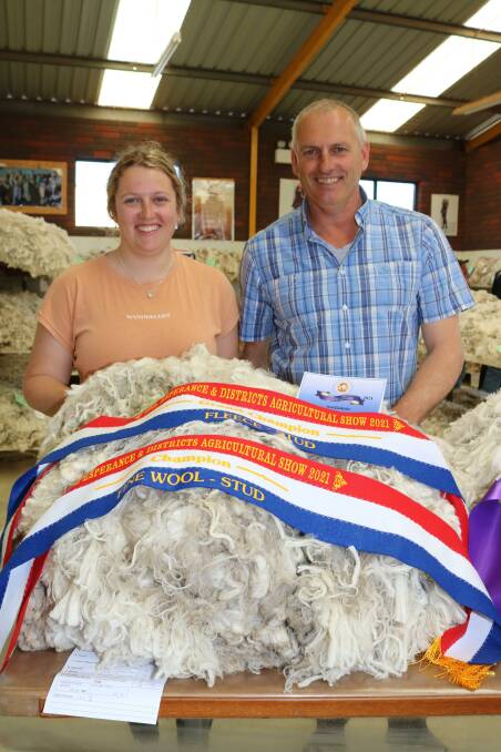 Demi Vandenberghe and her father David, Wattle Dale stud, Scaddan, with their champion fine wool and grand champion stud fleece.