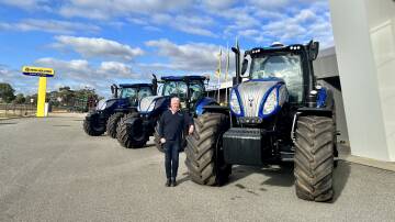 Ben Daniell, sales manager for McIntosh & Son southern group, with New Holland tractor stock, including a T8.410 that had arrived that afternoon.