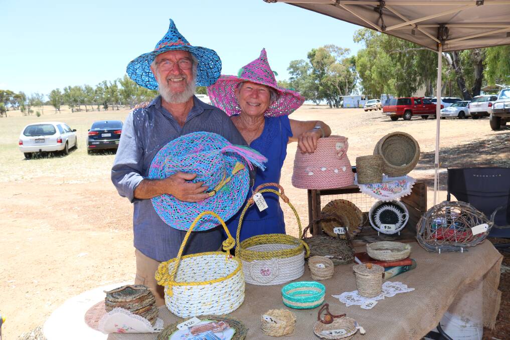 Geraldton couple Murray 'the madhatter'and Glenda 'the basketcase lady' Blyth, set up their stand containing his hats made from recycled hay baling twine and her pots and artworks made from recycled fishing ropes and natural fibres including dried grass and roots from around Lake Narembeen.