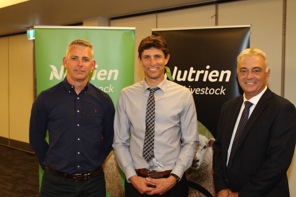 Mr Clayton (left), presented Wickepin/Kulin agent Ty Miller with a recognition award for his efforts in ensuring the success of last year's Corrigin/Wickepin special sheep sale, with Mr Giglia.