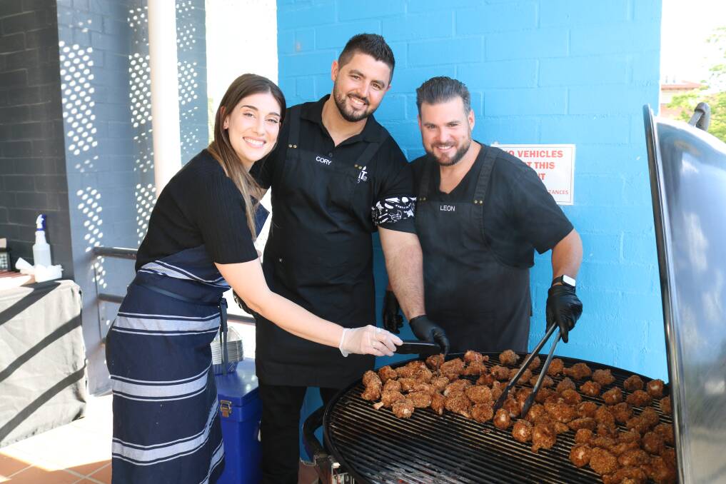 WAFarmers executive manager policy advocacy and engagement Jess Wallace checked on these spicy WA chicken wings provided by Cheat Meats caterers Cory Frayling and Leon Tartaglia.