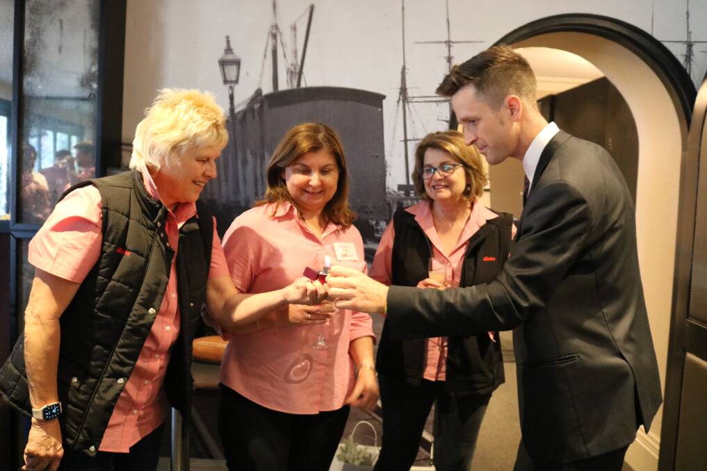 Intrigued by a little bit of magic provided by magician Robbie T, Perth, were Phillipa Ives (left) and Suzie Bennie, Midland and Susan Kouw, Donnybrook.
