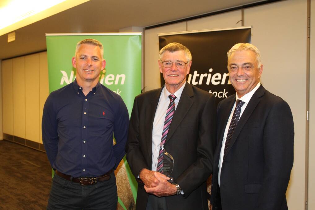 Nutrien Livestock Mt Barker agent Harry Carroll (centre), received a recognition award for his drive and work on the special Angus weaner sale at Mt Barker. He received his award from Mr Clayton (left) and Mr Giglia.