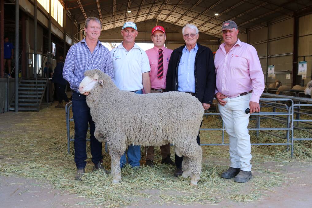East Mundalla stud co-principal Daniel Gooding (left), holds the $6250 second top-priced ram bought by Tim Adams, Kukerin, with Elders' area manager central, Matt Beckett, East Mundalla co-principal Philip Gooding and Elders Lake Grace livestock agent Graham Taylor.