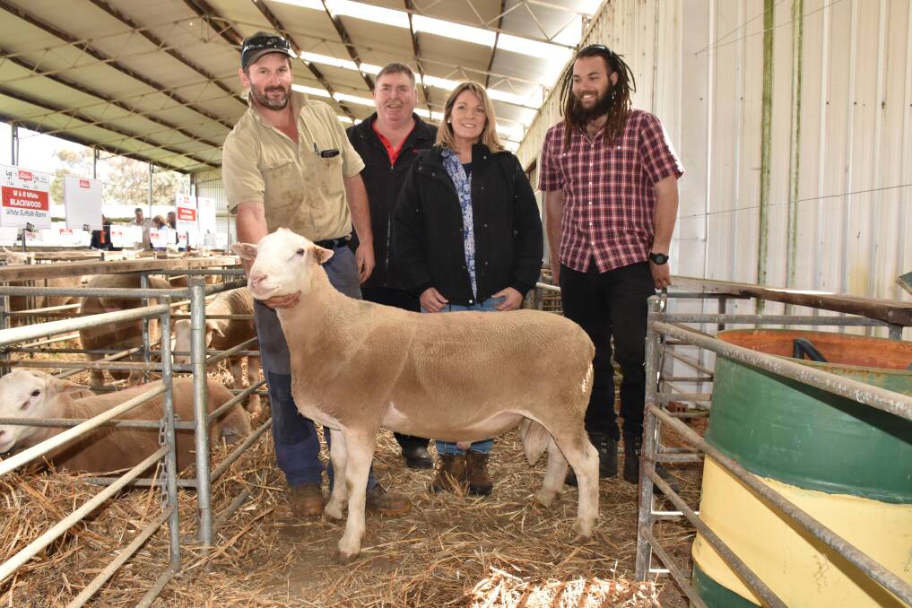 Dinninup ram sale top price buyer Tristan Mead (left), Boyup Brook, holds the $2000 ram he bought last week. With him were Elders Boyup Brook agent Peter Forrest and vendors Robyn and William White, Blackwood stud, Dinninup.